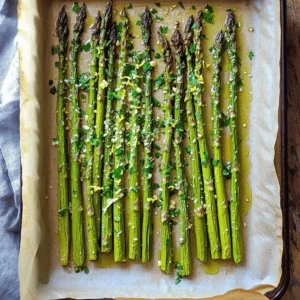 - 1 bunch of fresh asparagus, trimmed - 3 tablespoons olive oil - 4 cloves garlic, minced - 1/2 cup grated Parmesan cheese - 1 teaspoon lemon zest - 1/2 teaspoon red pepper flakes (optional) - Salt and pepper to taste - Fresh parsley, chopped (for garnish) Selecting fresh asparagus Choose asparagus that is bright green and firm. The tips should be tightly closed. Avoid any stalks that are wilting or have brown spots. Choosing the right olive oil Use a high-quality extra virgin olive oil. It adds a rich flavor and helps the asparagus roast nicely. Look for oils labeled as cold-pressed for the best taste. The importance of freshly grated Parmesan Freshly grated Parmesan cheese melts better and has a more robust flavor than pre-grated cheese. Grate your cheese just before using it for the best results. For the complete recipe, check out the [Full Recipe]. Enjoy making this delicious side dish! 1. Preheat the oven and prepare the baking sheet First, set your oven to 425&deg;F (220&deg;C). This hot oven helps the asparagus roast nicely. Line a baking sheet with parchment paper. This makes cleanup easy. 2. Toss asparagus with olive oil Take your fresh asparagus and trim the tough ends. Place them in a large bowl. Drizzle three tablespoons of olive oil over the asparagus. Toss them well, so they are coated evenly. 1. Add seasonings, and spreading asparagus on the sheet Next, add four minced garlic cloves, half a cup of grated Parmesan cheese, and one teaspoon of lemon zest to the bowl. If you like a kick, sprinkle in half a teaspoon of red pepper flakes. Season with salt and pepper. Toss everything again until the asparagus is well coated. Then, spread the asparagus in a single layer on your prepared baking sheet. 2. Roasting time and checking for doneness Place the baking sheet in the preheated oven. Roast the asparagus for 15 to 20 minutes. Check them for tenderness. They should be soft yet still have a slight crunch. The edges will become slightly crispy. 1. How to garnish and serve the dish Once the asparagus is done, take it out of the oven. Let it cool for a few minutes. Garnish with freshly chopped parsley for a pop of color. This adds a nice touch and fresh flavor. 2. Pairing options for Garlic Parmesan Roasted Asparagus Garlic Parmesan Roasted Asparagus pairs well with many dishes. Serve it alongside grilled chicken or fish for a complete meal. You can also enjoy it with pasta or on a bed of rice. This dish adds great flavor and nutrition to any plate. For the full recipe, check out the details above. - Ideal oven temperature: Set your oven to 425&deg;F (220&deg;C). This high heat helps the asparagus roast perfectly. You will get a nice crisp outside while keeping the inside tender. - How to avoid overcooking asparagus: Check your asparagus after 15 minutes. If you see brown edges, it's done. Asparagus cooks quickly, so stay close during the last few minutes. - Creative serving suggestions: Serve Garlic Parmesan Roasted Asparagus on a bed of fluffy rice or alongside grilled chicken. This adds color and flavor to your plate. You can even toss it in a fresh salad for extra crunch. - Best time to serve for freshness: Serve this dish right after cooking. The flavors are bright, and the texture is crisp. If you need to hold it, cover it with foil to keep it warm. - Best baking sheets or cookware to use: Use a rimmed baking sheet lined with parchment paper. This makes cleanup easy and helps the asparagus roast evenly. - Tools for preparing asparagus: A sharp knife works best for trimming. A large mixing bowl is great for tossing the asparagus with the olive oil and seasonings. A pair of tongs is helpful for flipping the asparagus when needed. For the full recipe, check out the detailed steps above. {{image_2}} You can change the flavors in Garlic Parmesan Roasted Asparagus easily. Try adding fresh herbs like thyme or rosemary for a fragrant twist. If you prefer a bit of heat, use crushed red pepper instead of flakes. You can also swap out the Parmesan cheese. Nutritional yeast gives a cheesy flavor without dairy. Or use pecorino Romano for a sharper taste. Making this dish gluten-free is simple. All the ingredients are naturally gluten-free. Just be sure to check labels on any packaged items. For a vegan version, omit the Parmesan and use a plant-based cheese. You can also blend cashews with nutritional yeast for a creamy, cheesy sauce. You can adapt this recipe for seasonal vegetables. In spring, use asparagus, but in summer, try zucchini or green beans. In fall, roasted Brussels sprouts work well. This dish shines during holiday meals too. Serve it alongside turkey or ham for a festive touch. It adds color and flavor to any table. To keep your Garlic Parmesan Roasted Asparagus fresh, store it correctly. First, let the asparagus cool down completely. Then, place it in an airtight container. This will help keep the moisture in and prevent it from getting soggy. You can store it in the fridge for up to 3 days. If you want to keep it longer, consider freezing it. Just make sure to use freezer-safe bags or containers. Frozen asparagus can last up to 2 months. For reheating, the best method is the oven. Preheat your oven to 350&deg;F (175&deg;C). Place the asparagus on a baking sheet and heat for about 10 minutes. This keeps it crispy. If you want to use a microwave, use a low power setting. Heat it in short bursts, checking often. This will help avoid sogginess. To achieve the same great texture, add a splash of olive oil before reheating. Enjoy your leftovers just like the first time! For the full recipe, check out the section above. Can I use frozen asparagus for this recipe? Yes, you can use frozen asparagus. However, fresh asparagus will give you the best taste and texture. If you use frozen, thaw it first. Pat it dry before cooking. This helps avoid sogginess. What is the best way to trim asparagus? To trim asparagus, hold the stalk in your hands. Bend it gently until it snaps. This breaks off the tough end. You can also cut about an inch from the bottom with a knife. How can I make this recipe ahead of time? You can prep the asparagus a few hours in advance. Toss it with oil, garlic, and seasonings. Store it in the fridge until you are ready to roast. This makes it easy to cook when needed. What are other dishes that pair well with Garlic Parmesan Roasted Asparagus? Garlic Parmesan Roasted Asparagus goes well with grilled chicken or fish. It also pairs nicely with pasta dishes. You can serve it alongside a fresh salad for a light meal. How many calories are in Garlic Parmesan Roasted Asparagus? One serving has about 150 calories. This may vary based on the amount of olive oil used. It&rsquo;s still a healthy side dish that fits well into many diets. What are the health benefits of asparagus? Asparagus is low in calories and high in nutrients. It contains vitamins A, C, E, and K. It also has fiber, which aids digestion. Plus, it has antioxidants that help keep you healthy. This blog post shared easy steps for a tasty Garlic Parmesan Roasted Asparagus dish. We covered ingredients, cooking techniques, and expert tips for the best results. You learned how to select fresh asparagus, use the right oils, and the benefit of fresh cheese. Remember, cooking should be fun and flexible. Feel free to experiment with flavors or pairings. Enjoy making and sharing this tasty side dish! It&rsquo;s sure to impress at any meal.