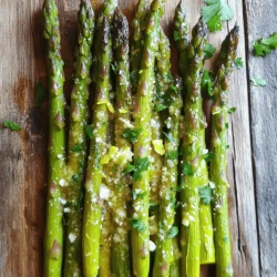 - Fresh asparagus - Garlic - Olive oil - Lemon zest and juice - Seasonings To make Garlic Lemon Asparagus, you need fresh asparagus. Look for firm, bright green stalks. They should snap when bent. Next, grab some garlic. Four cloves minced will give a great flavor. Olive oil adds richness. Use two tablespoons to coat the asparagus. Lemon zest adds zing, while lemon juice brightens the dish. Don’t forget seasonings like salt and black pepper to taste. - Red pepper flakes - Grated Parmesan cheese - Fresh parsley for garnish For a little heat, add red pepper flakes. Just a pinch will do! Grated Parmesan cheese gives a creamy touch. Sprinkle it on in the last minutes of roasting. Fresh parsley adds a pop of color and freshness. You can use it as a garnish when serving. For the full recipe, check out the details and instructions in the [Full Recipe]. Start by rinsing the asparagus under cold water. This step removes any dirt or grit. Next, you need to trim the woody ends. These parts are tough and not pleasant to eat. You can snap them off with your hands or cut them with a knife. I prefer snapping, as it is quick and fun! To make the marinade, gather a small bowl. Combine minced garlic, olive oil, lemon zest, lemon juice, salt, black pepper, and red pepper flakes if you want some heat. Mix these ingredients well. This marinade is the key to great flavor. You can adjust the lemon juice and garlic to fit your taste. If you love lemon, add more juice! Now, preheat your oven to 400°F (200°C). Spread the asparagus on a baking sheet. Pour the marinade over them and toss to coat. Arrange the asparagus in a single layer. This helps them cook evenly. Roast for 12 to 15 minutes. Stir halfway through for even cooking. When they're done, they should be tender and slightly charred. If you like, sprinkle grated Parmesan cheese in the last two minutes of roasting. This adds a nice touch! Enjoy your Garlic Lemon Asparagus! For the complete recipe, check the Full Recipe. To get the best roast, you need to think about the thickness of the asparagus. Thicker stalks take longer to cook than thin ones. Aim for 12-15 minutes in the oven. For thin asparagus, check after 10 minutes. To check if your asparagus is done, look for a bright green color and slight char. Use a fork to poke the stalks. They should be tender but not mushy. You can boost the flavor with different herbs. Try thyme or basil for a twist. For even more brightness, add a splash of orange juice or lime along with the lemon. It gives a fresh taste. When plating, arrange the asparagus in a nice line or a fan shape. This makes it look inviting. You can also sprinkle some lemon zest on top for a pop of color. Garnish with fresh parsley or even toasted nuts for a crunchy touch. It adds flavor and looks great on the plate. For the full recipe, check out the full recipe section. {{image_2}} Adding cheese makes this dish even richer. For a creamy touch, sprinkle grated Parmesan on top. It melts nicely during the last minutes of roasting. Other great choices include Pecorino Romano or a soft goat cheese. These cheeses add a unique flavor twist. You can mix and match to find your favorite! To add some heat, try different chili flakes. You can use red pepper flakes, or even go for crushed serrano peppers. Start with a small amount, then taste it. Balance the heat with the lemon's brightness and the garlic's boldness. This mix creates a tasty contrast that makes your taste buds dance! Grilling gives asparagus a smoky flavor. First, preheat your grill to medium-high heat. Toss the asparagus in olive oil, lemon juice, and garlic. Then, place them directly on the grill. Cook for 8 to 10 minutes. Turn them halfway for even grilling. You want them tender with nice grill marks. Grilled asparagus pairs well with summer meals. For a fun twist, serve it with a squeeze of fresh lemon juice. For the full recipe, check out the Zesty Garlic Lemon Asparagus! To keep leftover asparagus fresh, place it in the fridge. Wrap it in a damp paper towel and then put it in a plastic bag. This helps maintain moisture. Asparagus lasts about 3 to 5 days in the fridge. Check for any slimy texture or a strong smell; these are signs that it has spoiled. Reheating asparagus can be tricky. You want to keep it tender, not mushy. The best way to reheat is in the oven. Preheat your oven to 350°F (175°C) and place the asparagus on a baking sheet. Heat for about 5 minutes. If you use a microwave, do it in short bursts. Heat for 30 seconds at a time, checking the texture after each burst. This way, you keep your tasty garlic lemon asparagus delicious! For the full recipe, check out the complete guide. To prepare asparagus, start by rinsing it under cold water. This step removes dirt and debris. Next, trim the woody ends. You can snap them off or cut them with a knife. This makes the asparagus tender and easy to eat. For cooking, roasting is my favorite method. It brings out the natural sweetness. - Quick tips for trimming and cooking asparagus: - Rinse and trim the ends before cooking. - Roast at 400°F for a tender bite. - Toss with olive oil and seasonings for flavor. Yes, you can make Garlic Lemon Asparagus ahead of time. Just follow the recipe and let it cool. Store it in an airtight container in the fridge. It stays fresh for up to three days. When you are ready to eat, reheat it in the oven. This keeps the texture nice. - Tips for meal prep and storage: - Cook and cool asparagus fully before storing. - Use an airtight container to keep it fresh. - Reheat at a low temperature to maintain taste. Garlic Lemon Asparagus pairs well with many dishes. It complements grilled chicken, fish, or steak nicely. You can also serve it with pasta or rice for a hearty meal. The bright lemon flavor enhances rich main courses. - Suggested main courses and sides for a complete meal: - Grilled chicken breast or fish fillets. - Pasta tossed with olive oil and herbs. - Quinoa salad for a healthy side. For the full recipe, check the main section above. Enjoy cooking! In this post, we covered how to make Garlic Lemon Asparagus from start to finish. We explored essential and optional ingredients, step-by-step instructions, and helpful tips for perfect results. Try adding cheese or spice to change the dish’s flavor. Remember to store leftovers properly for later enjoyment. With these insights, you can enjoy a bright and tasty side dish. Simple changes can make your meals stand out. Enjoy your cooking adventure!