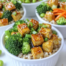 To make Minute Sesame Teriyaki Tofu Bowls, you need the following: - 1 block (14 oz) firm tofu, pressed and cubed - 2 tablespoons soy sauce - 2 tablespoons teriyaki sauce - 1 tablespoon sesame oil - 1 tablespoon honey or agave syrup (for a vegan option) - 1 teaspoon grated fresh ginger - 1 teaspoon minced garlic - 2 cups cooked brown rice or quinoa - 1 cup steamed broccoli florets - 1 carrot, julienned - 2 green onions, sliced - 1 tablespoon sesame seeds - Optional: Edamame for garnish If you don't have certain items, don't worry. Here are some swaps you can use: - For tofu, use tempeh or seitan for a different texture. - Swap soy sauce with tamari for a gluten-free option. - Use maple syrup instead of honey or agave if needed. - If you can't find sesame oil, olive oil works fine too. - For rice or quinoa, try farro or couscous for a fun twist. To make your bowls pop, consider these toppings: - Sprinkle extra sesame seeds on top for crunch. - Add sliced radishes for a fresh bite. - Toss in some avocado for creaminess. - A drizzle of sriracha can add heat. - Edamame is a great green addition. These ingredients and tips will help you create a tasty and colorful meal. Enjoy the cooking process and feel free to experiment with flavors! To start, you need to press the tofu. This step helps remove extra moisture. Wrap the tofu block in a clean kitchen towel. Place a heavy object on top for 15 to 20 minutes. This makes the tofu firm and helps it soak up flavor. After pressing, cut the tofu into small cubes. Make sure they are even for cooking. While the tofu presses, prepare the teriyaki sauce. In a small bowl, mix soy sauce, teriyaki sauce, sesame oil, and honey or agave syrup. Add grated ginger and minced garlic to the bowl. Whisk everything together until smooth. Set the sauce aside. The flavors will blend and create a tasty coating for your tofu. Next, heat a large non-stick skillet over medium heat. Add a small amount of oil to the skillet. Once hot, add the cubed tofu. Cook the tofu for about 5 to 7 minutes. You want it to be golden brown on all sides. Then, pour the teriyaki sauce over the tofu. Cook for another 3 to 4 minutes. This allows the sauce to thicken and coat the tofu evenly. Now it’s time to serve! In four bowls, place cooked brown rice or quinoa as the base. Top each bowl with the sautéed teriyaki tofu, steamed broccoli, and julienned carrots. Finish by garnishing with sliced green onions, sesame seeds, and optional edamame. Enjoy your quick and tasty meal! The key to great tofu is how you cook it. I love to press the tofu first. Pressing helps remove water. This step makes the tofu crispy and allows it to soak up flavors. After pressing, you can sauté, bake, or grill the tofu. Each method gives a unique taste. - Sautéing: This is quick and easy. Use a non-stick skillet to get that golden color. - Baking: Bake at 400°F for about 25-30 minutes for a firmer texture. - Grilling: For a smoky flavor, grill on medium heat for about 10-15 minutes. Getting the teriyaki sauce right is vital. A good sauce has a balance of sweet and salty. I like to mix soy sauce, teriyaki sauce, sesame oil, honey or agave, ginger, and garlic. - Tip: Whisk the sauce well to combine all flavors. - Pro Tip: Let it simmer for a few minutes to thicken. This helps it cling to the tofu nicely. Presentation makes your meal more fun. Start with a base of brown rice or quinoa. Then, layer the tofu and veggies on top. - Use colorful vegetables like broccoli and carrots for a vibrant look. - Garnish with sliced green onions and sesame seeds for extra flair. - Optionally, drizzle some teriyaki sauce over the top to make it shine. These simple tips will elevate your Minute Sesame Teriyaki Tofu Bowls. Enjoy your cooking adventure! {{image_2}} You can easily make this dish vegan. Simply swap honey for agave syrup. This change keeps the sweetness while keeping it plant-based. You can also add more veggies to boost flavor and nutrition. Try using mushrooms or bell peppers. Both add a nice bite and taste. Feel free to customize your bowls with extra veggies. Some great options include: - Spinach, for a fresh touch - Zucchini, for a mild flavor - Snow peas, for crunch Adding these veggies can make your dish more colorful and exciting. Plus, they can help you meet your daily veggie goals. Just remember to steam or sauté them lightly to keep their texture. If you want to switch up the base grains, you have many choices. Here are some alternatives: - Quinoa, for a nutty flavor - Cauliflower rice, for a low-carb option - Couscous, for a quick and fluffy base These alternatives can change the dish's texture and flavor. Each option offers a unique twist, so feel free to experiment! Store any leftover Minute Sesame Teriyaki Tofu Bowls in an airtight container. Make sure to keep it in the fridge. It will stay fresh for up to four days. If you need to store the tofu separately, that works too. Just place it in its own container. To reheat, place the leftover tofu bowls in the microwave. Heat them for about one to two minutes. Stir halfway through to ensure even warming. You can also use a skillet on medium heat. Add a splash of water to keep it moist. Heat for about five minutes or until warm. You can freeze the tofu, but it is best to do it before cooking. After pressing and cubing, freeze the tofu in a single layer. This keeps it fresh for about three months. When ready to use, thaw it in the fridge overnight. Cook it as per the recipe. Do not freeze the rice or veggies, as they do not freeze well. Yes, you can use different sauces for your bowls. If you prefer a sweeter taste, try hoisin sauce. For a spicier kick, add sriracha or chili garlic sauce. You can also mix soy sauce with maple syrup for a unique flavor. Experiment with these sauces to find your favorite twist. Pressing tofu is simple. Wrap the block in a clean kitchen towel. Place a heavy object on top, like a cast iron pan or a few canned goods. Let it sit for 15-20 minutes. This method removes excess moisture and helps the tofu absorb flavors better. It’s key for achieving a nice texture when cooking. These bowls pair well with various sides. Serve them with steamed vegetables, like broccoli or snap peas. You can also add a fresh salad with a light dressing. For extra protein, toss in some edamame or serve with miso soup. These options complement the dish and add more nutrition. In this blog post, I covered the key steps to create a delicious sesame teriyaki tofu bowl. We discussed ingredients, preparations, cooking methods, and storage tips. Knowing how to press tofu, make the teriyaki sauce, and choose toppings can elevate your dish. Embrace variations like vegan options and additional veggies to personalize your meal. Keep these tips in mind for a tasty, easy cooking experience. Enjoy creating and sharing your own sesame teriyaki tofu bowl!